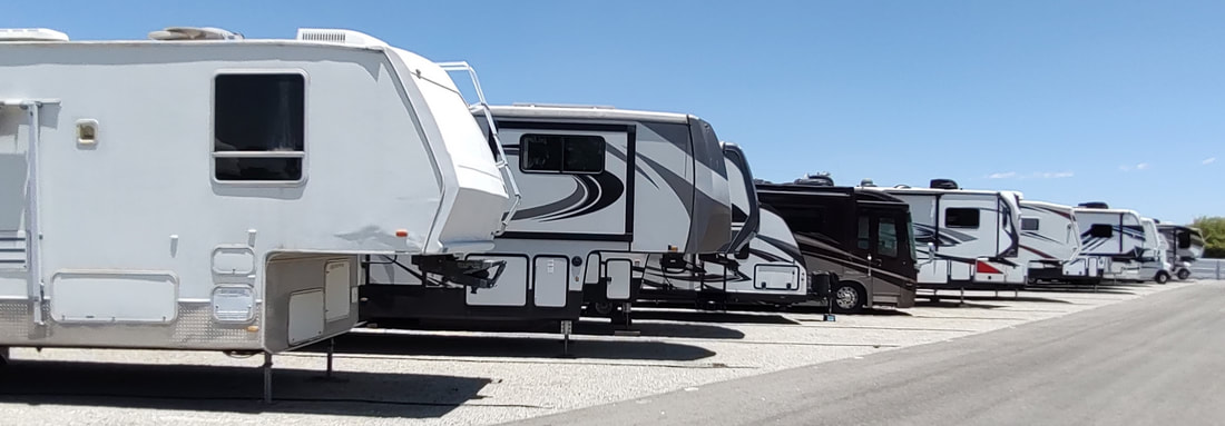 Spacious outdoor RV storage lot with wide driveways at Arbor RV Storage in Menifee, CA